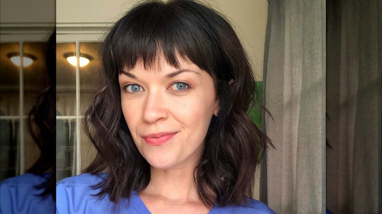 woman with grown-out cowgirl bob
