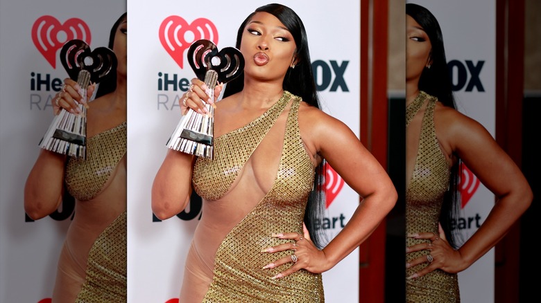 Megan Thee Stallion poses with an award at the2021 iHeartRadio Music Awards