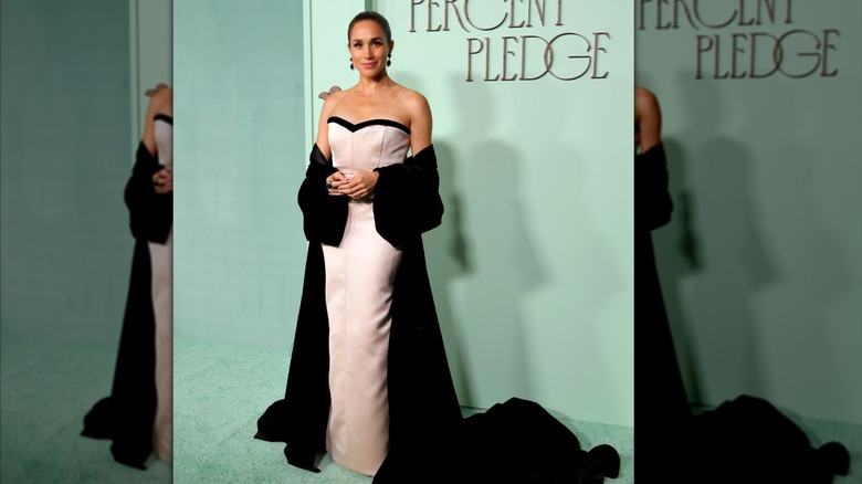 Meghan Markle wearing a champagne dress at the Fifteen Percent Pledge Fundraising Gala