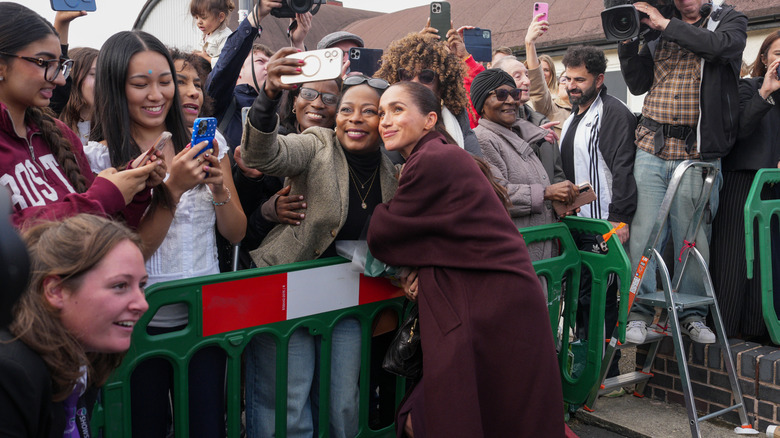 Meghan Markle posing with British fans in October 2026.