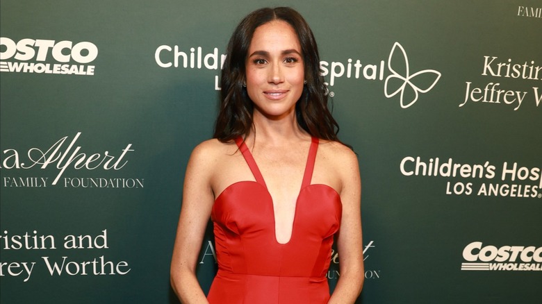 Meghan Markle in red gown at 2024 Children's Hospital Los Angeles Gala.