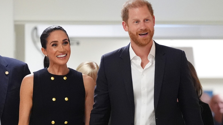 Meghan Markle and Prince Harry smile at a hospital in Melbourne