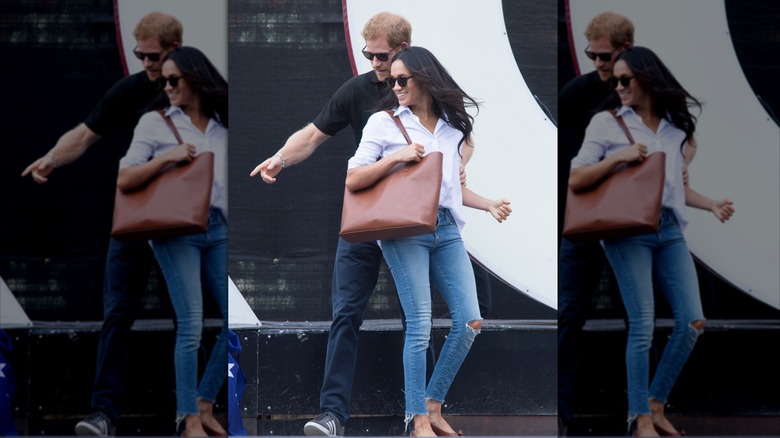 Meghan Markle wears skinny jeans, a button-down shirt, and flats