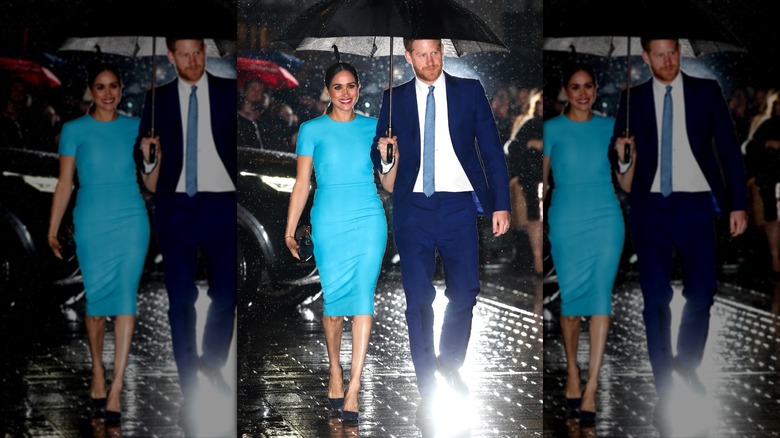 Meghan Markle wearing a turquoise dress next to Prince Harry in a suit