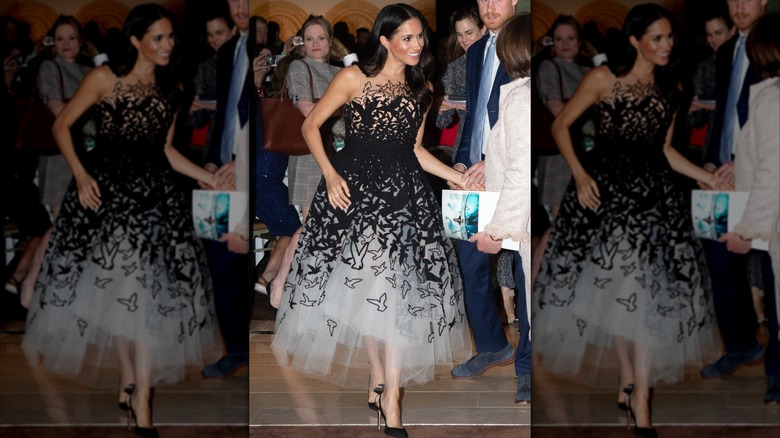 Meghan Markle wearing a black-and-white bird-adorned dress