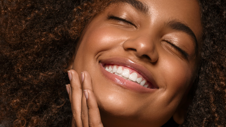 A woman smiling