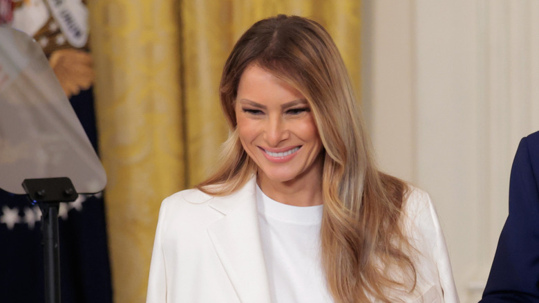 Melania Trump smiles for a crowd