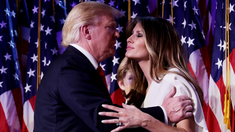 Donald Trump and Melania Trump sharing an embrace
