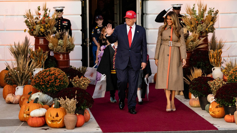 U.S. President Donald Trump and First Lady Melania Trump handout candy to children during the annual Halloween at the White House event on the South Lawn of the White House on October 30, 2025 in Washington, DC (2025)