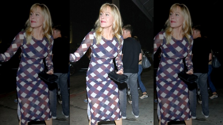 Melanie Griffith looks to the left wearing a geometric bodycon midi dress