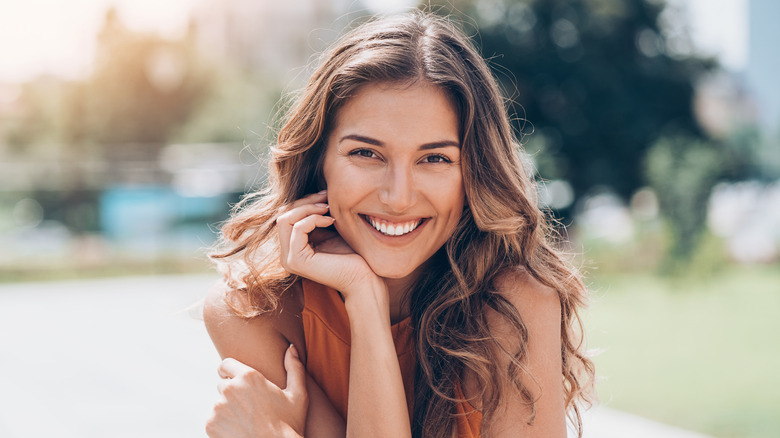 Woman with wavy hair smiling