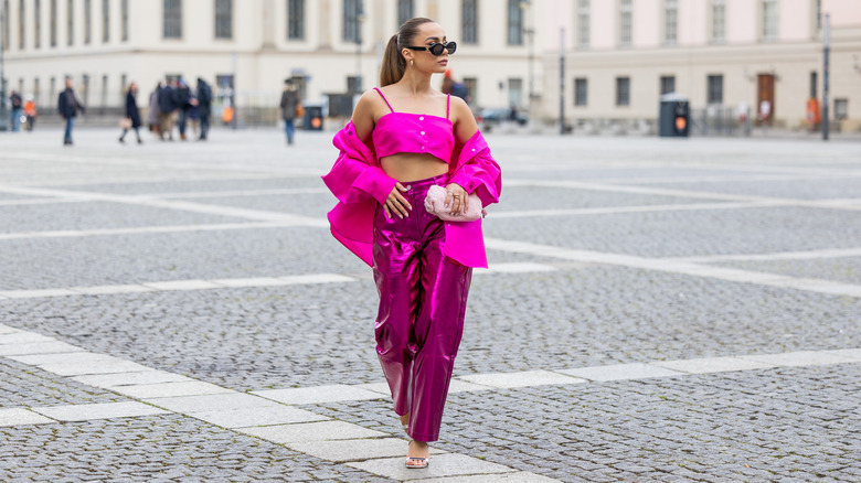 woman wearing all-pink outfit with pink metallic pants