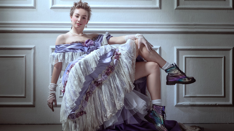 Woman wearing dress and metallic boots