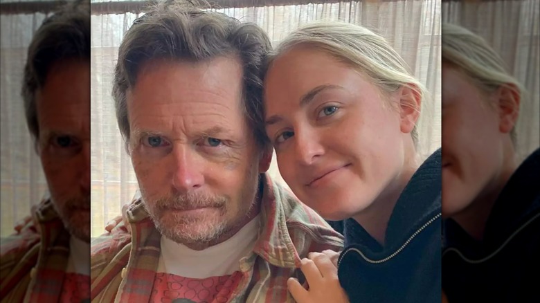 Michael J. Fox takes a photo with his daugther Aquinnah Fox