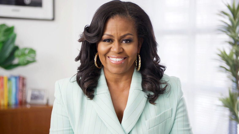 michelle obama wearing blue pinstripe blazer