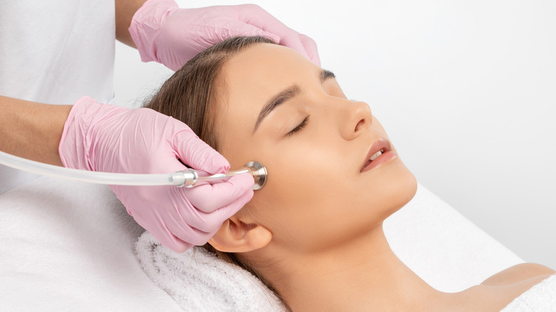 woman receiving dermabrasion treatment