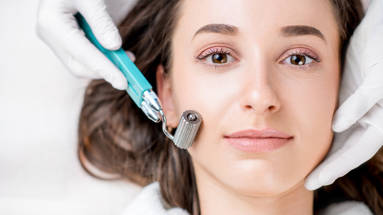 woman getting microneedling done