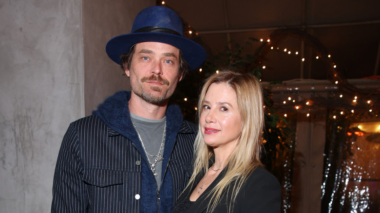 Christopher Backus and Mira Sorvino posing together