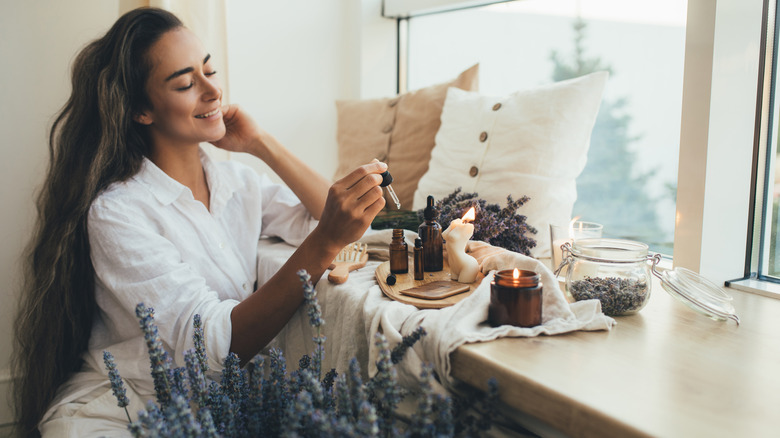 Woman making essential oil blend