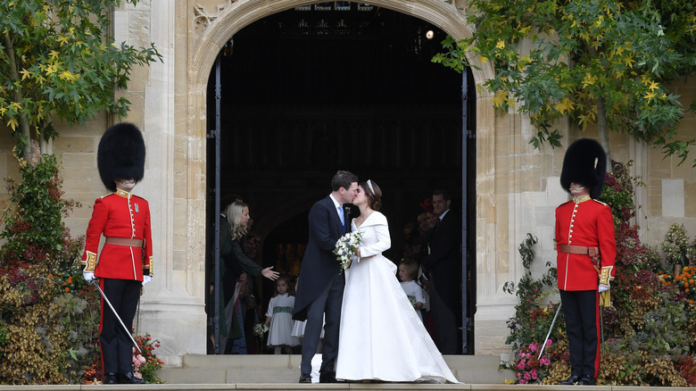 Princess Eugenie and Jack Brooksbank kissing at St. George's Chapel on their wedding day.