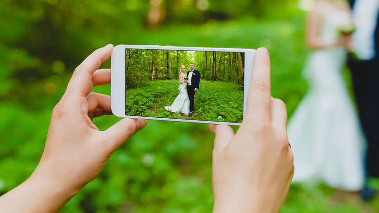 Wedding content creator taking photo