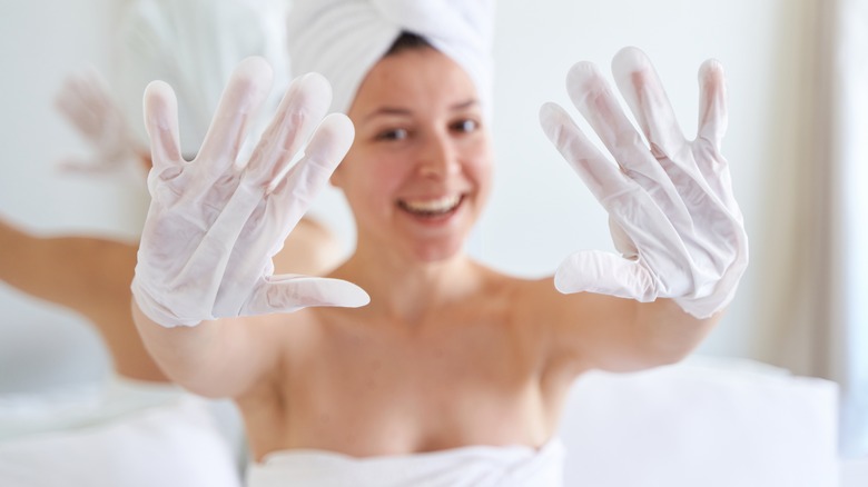 woman wearing moisturizing gloves