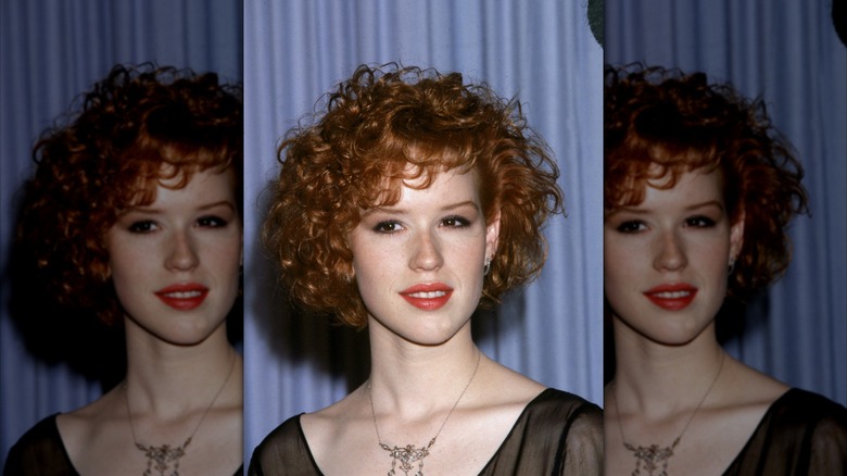 Molly Ringwald poses backstage at the Academy Awards 1986