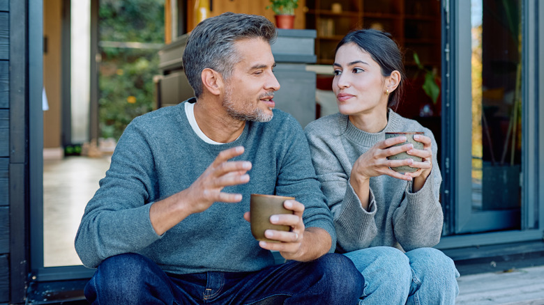 Couple talking over coffee
