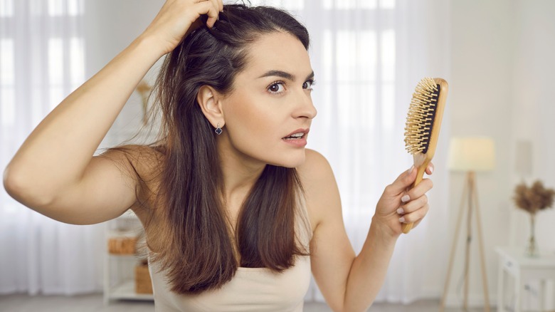 Woman brushing hair