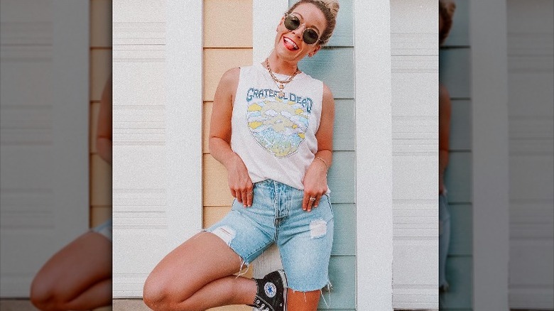 Woman poses in muscle tank