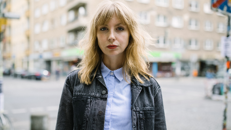 Serious woman with blond hair