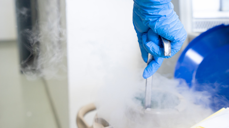 Person opening liquid nitrogen tank