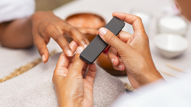 Person getting a manicure 