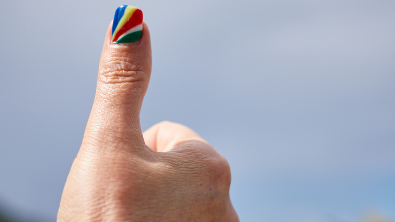 Thumbs up with beautiful manicure