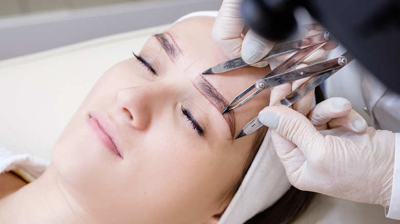woman getting eyebrow procedure