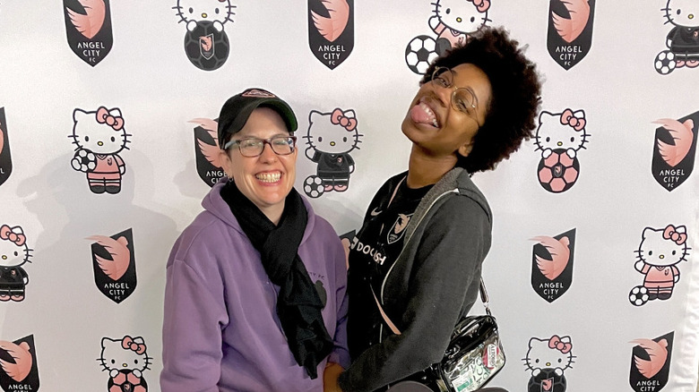Diona Reasonover and wife Patricia Villetto pose for a photo at a soccer game