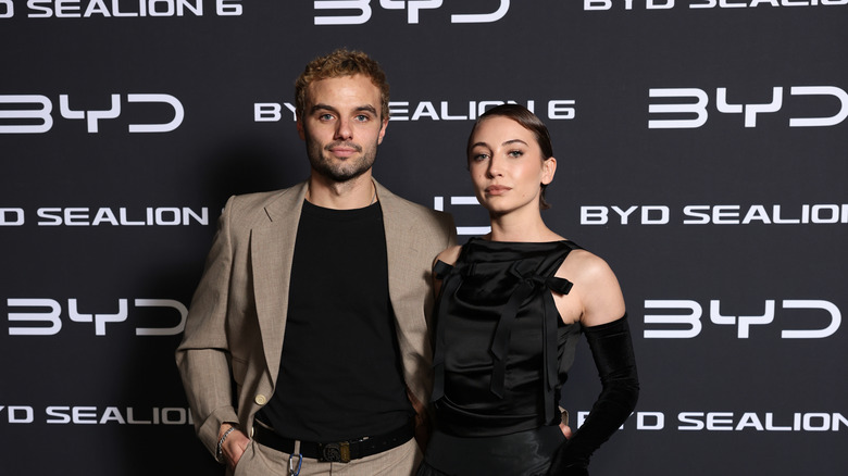 Josh McKenzie and Mavournee Hazel pose together on a red carpet