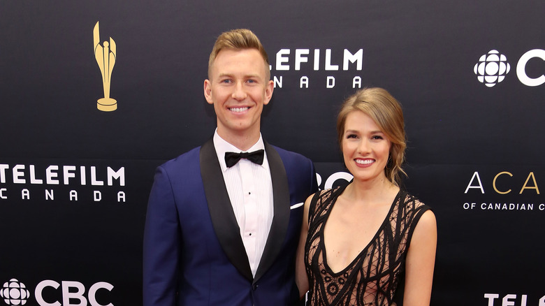 Tori Anderson and husband Mitch Myers pose together on a red carpet