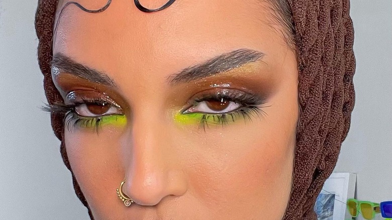 Close-up of neon eye makeup