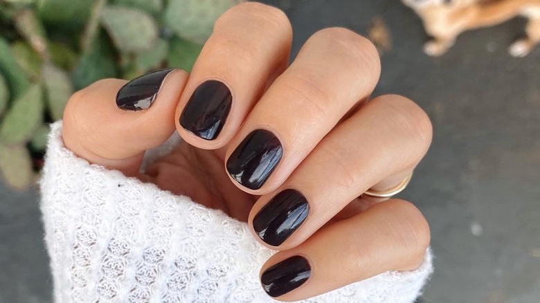 sweater and black fingernails