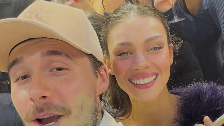 Brooklyn Beckham and Nicola Peltz smiling