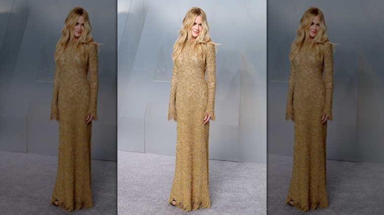 Nicole Kidman in a gold long sleeved dress