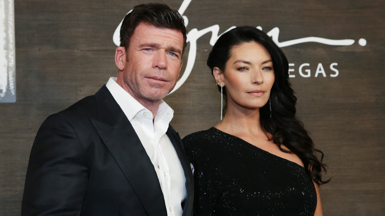 Taylor and Nicole Sheridan are pictured in black formal wear while attending a red carpet event.