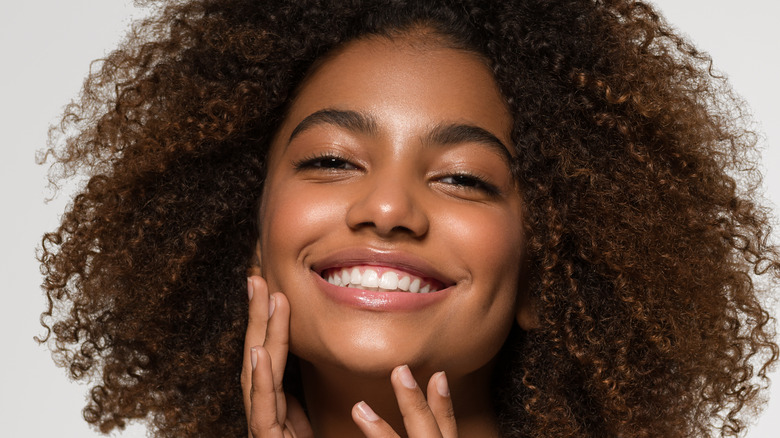 Smiling woman with natural hair
