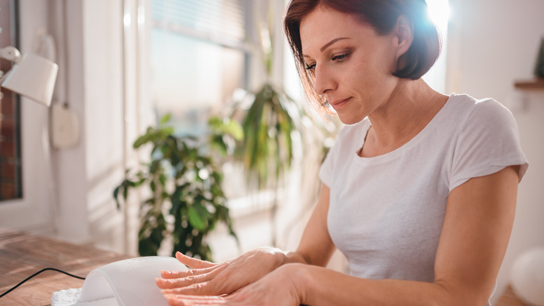 woman looking at hands