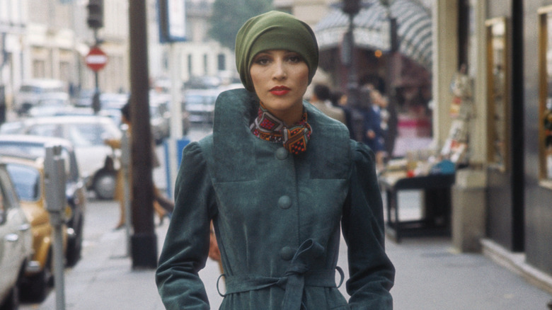 A fashion model wearing a headscarf in the 1970s