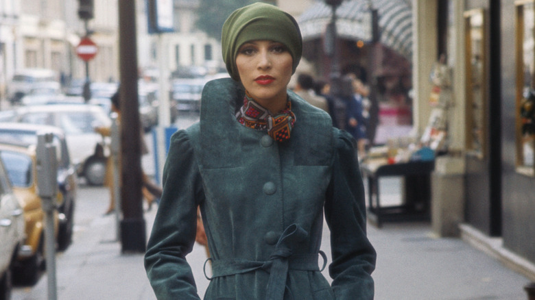 A fashion model wearing a headscarf in the 1970s