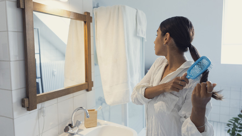 Woman brushing her hair