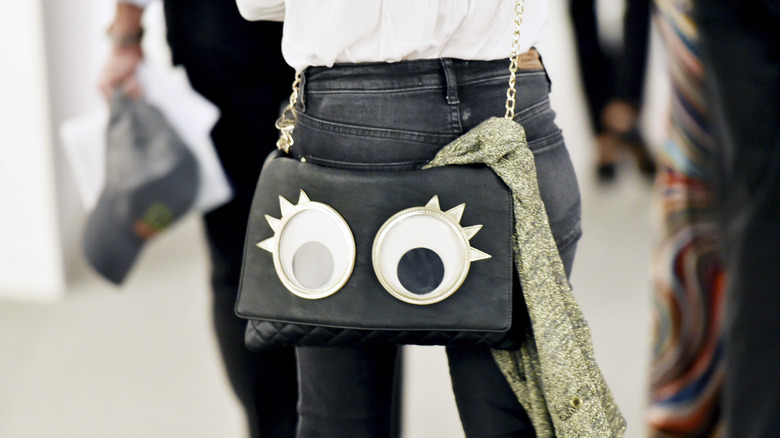 a purse with eyeballs