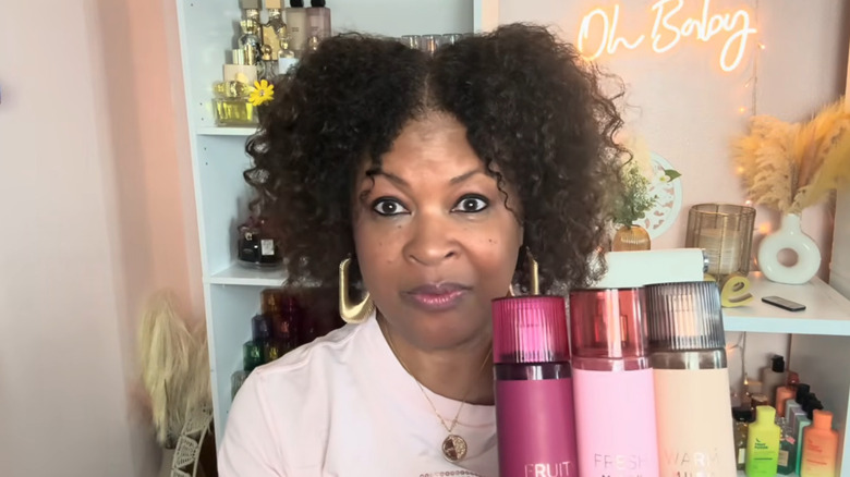 Woman holding body mists